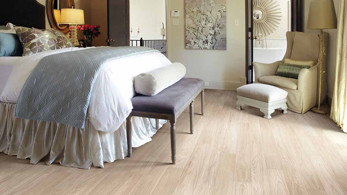 Wood-look laminate floor by Shaw Floors in bedroom setting 